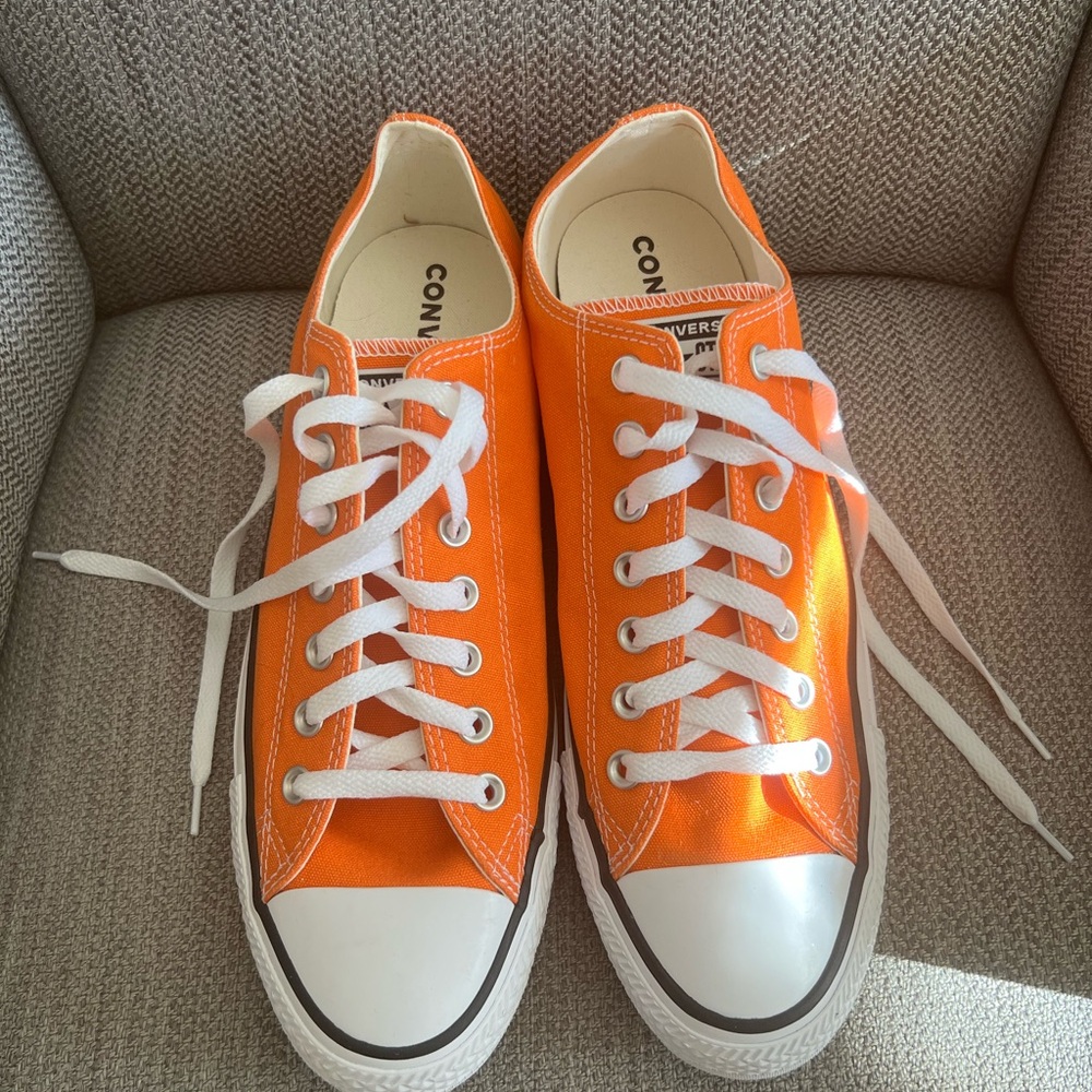 Brand new. Unisex. Orange low top converse sneakers